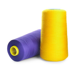 Different colorful sewing threads on white background