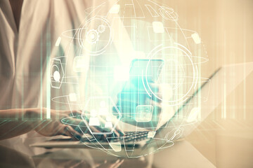 Double exposure of social network sketch hologram and woman holding and using a mobile device.