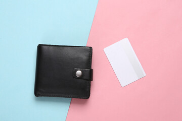 Purse and bank card on blue pink pastel background