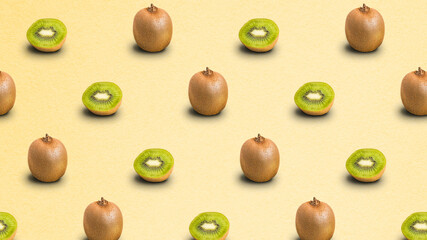 Repeated pattern of many whole and sliced ripe kiwi fruits on light yellow background. Textured paper background. 4k resolution.