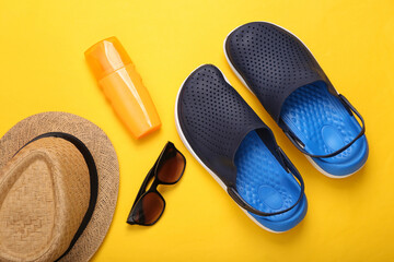 Composition Beach accessories on a yellow background. Summer background. Flat lay