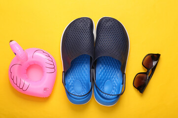 Composition Beach accessories on a yellow background. Summer background. Flat lay