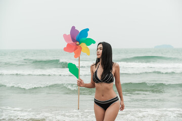 sexy asia woman wearing bikini on the beach
