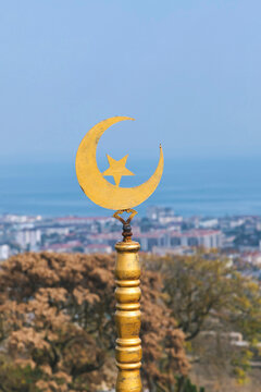 Yellow pole with star-and-crescent symbol