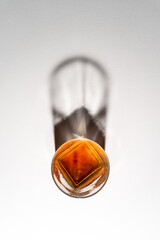 Overhead view of Glasses Of Whiskey Or Scotch On White Background with shadows