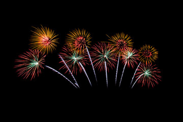 Many flashing colorful fireworks in event amazing with black background celebrate New Year, holiday and festival in night.