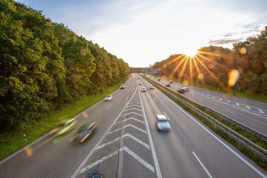 Germany, Bavaria, Munich, Traffic on Bundesautobahn 96 at sunset