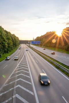 Germany, Bavaria, Munich, Traffic on Bundesautobahn 96 at sunset