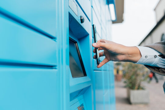 Woman scanning QR Code with smart phone