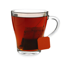Tea bag in glass cup of hot water isolated on white