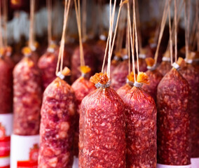 appetizing sausages on the counter of the sausage section of the supermarket