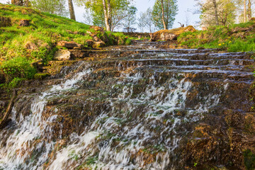 Waterfall in a ravine at spring