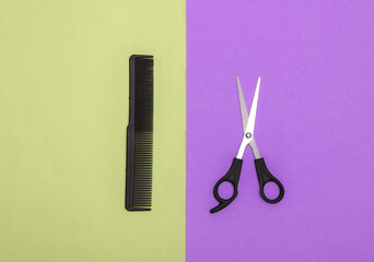 Comb and scissors on pink blue pastel background. Barber tool. Top view