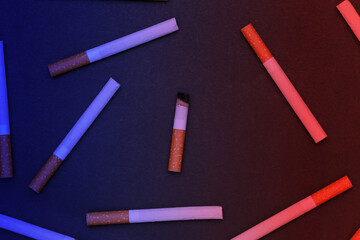 Background from many cigarettes on black background.