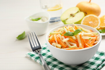 Delicious turnip salad served on white wooden table, space for text