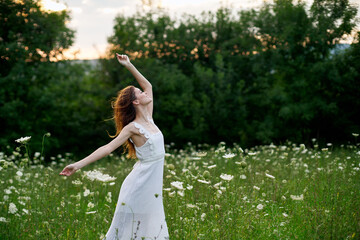 Naklejka na ściany i meble Woman in white dress posing dance nature summer