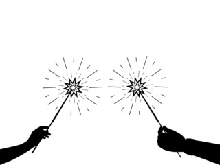 Silhouettes of hands with sparklers fireworks. Symbol holiday.