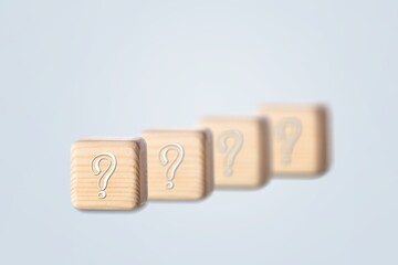 wooden blocks with a question mark. frequently asked questions marketing plan for educational ideas
