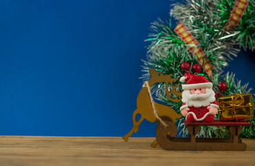 new year and christmas greeting card, santa claus and reindeer with gifts on sleigh, concept