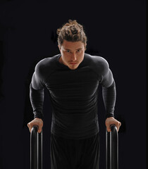 Free body workout portrait man on calisthenic parallel bars.