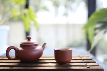 earthenware tea cup and tea pot