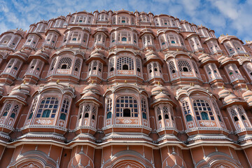 Hawa Mahal, pink palace of winds in old city Jaipur, Rajasthan, India. Background of indian...