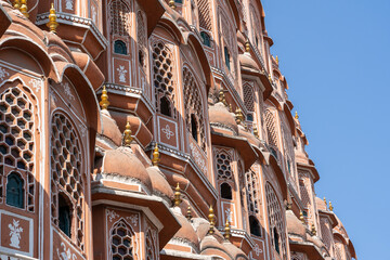 Hawa Mahal, pink palace of winds in old city Jaipur, Rajasthan, India. Background of indian...