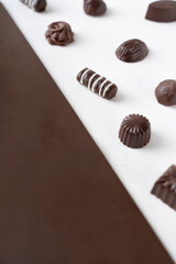 Chocolate candies in a cut on a white background