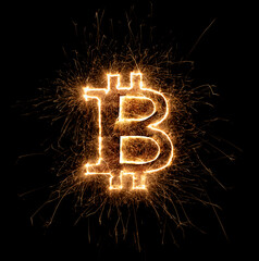 golden bright bitcoin crypto currency sparkler logo isolated dark black background. business...
