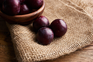 plums fruits natural products on a wooden table top view