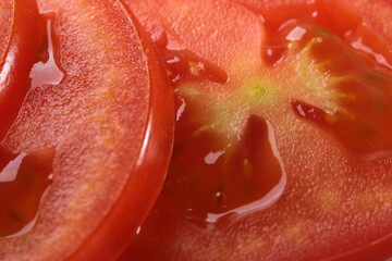 Sliced round slices of ripe red tomato
