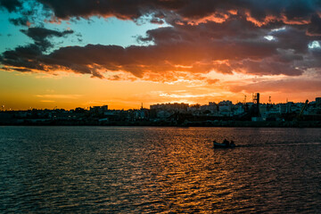 Naklejka premium sunset over the river