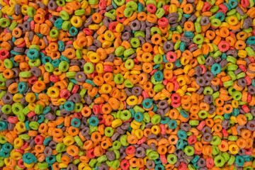 Fototapeta na wymiar Sweet multicolored flakes, cereal loops.