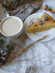 Coffee and cake. Still life with slice of apple pie, cup of latte coffee and pine bark sprinkled with powdered sugar