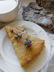  Cup of latte coffee and piece of apple pie on a decorated holiday table