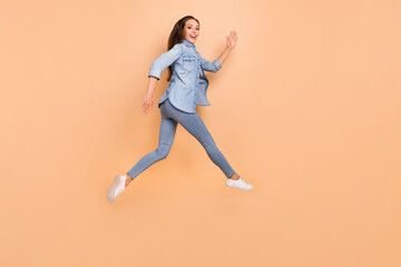 Fototapeta na wymiar Full size profile side photo of skinny girl running in air relaxing on summer weekend isolated on beige color background
