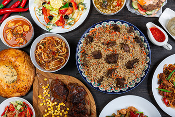 The concept of Eastern asian festive cuisine. Assorted Uzbek food set, pilaf, samsa, lagman, manti, shurpa restaurant concept Eastern arabic new year and Christmas dish from lamb served cookware.