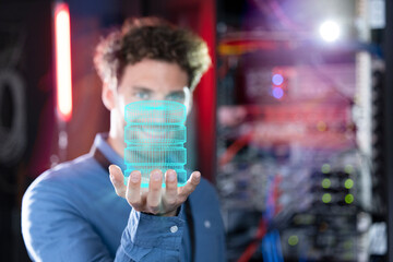 Digital composite image of male IT specialist holding database in server room