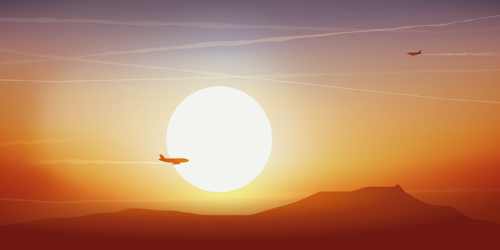 Concept du voyage et du transport aérien avec des avions de ligne qui se croisent dans le ciel au coucher du soleil.