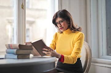 young woman reads history books