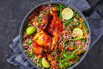 Roasted Half Chicken with brown rice in a skillet