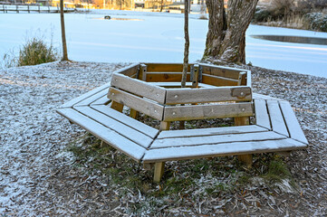 parkbench in public park a cold day in december