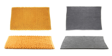 Set with soft bath mats on white background