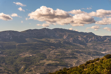 Fototapeta na wymiar Mountainous landscape on a sunny day with clouds.