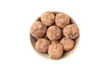 Sweet truffles in bowl isolated on white background