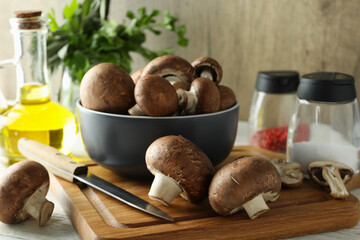 Concept of cooking with champignon on white wooden table