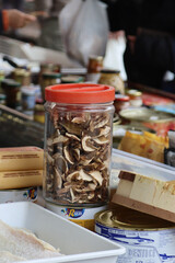 plastic container with dried mushrooms