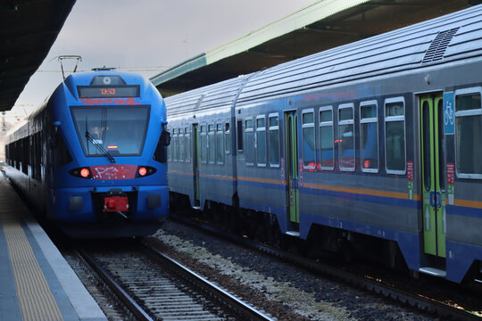 Commuter Trains At Station Stops