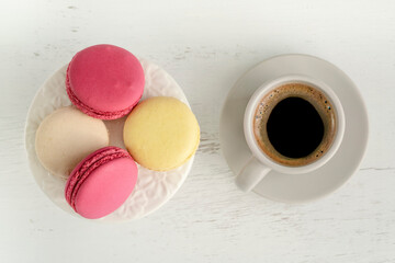 macaroons and cup of coffee on table