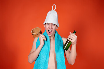 Portrait of a funny man with attributes for the sauna on an orange background. Hygiene and spa.